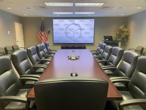 conference-room-with-leather-chairs-and-large-screen