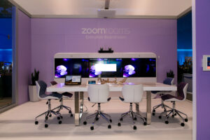 a conference room with a purple wall and white chairs