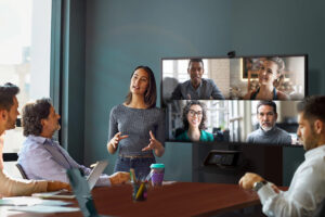 people sitting in a conference room having a discussion 