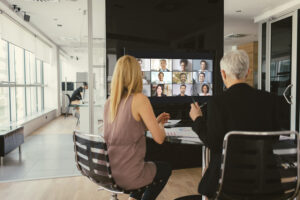 A collaboration space uses a large display to connect with remote workers.