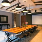 Beautiful conference room with a long table, chairs, and an interactive screen at the front of the room.