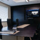 Conference room with display and Crestron control.