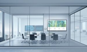 A comprehensive conference room featuring Crestron solutions seen through windows.