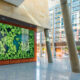 Large business atrium art feature with HD displays that attract visitors’ attention